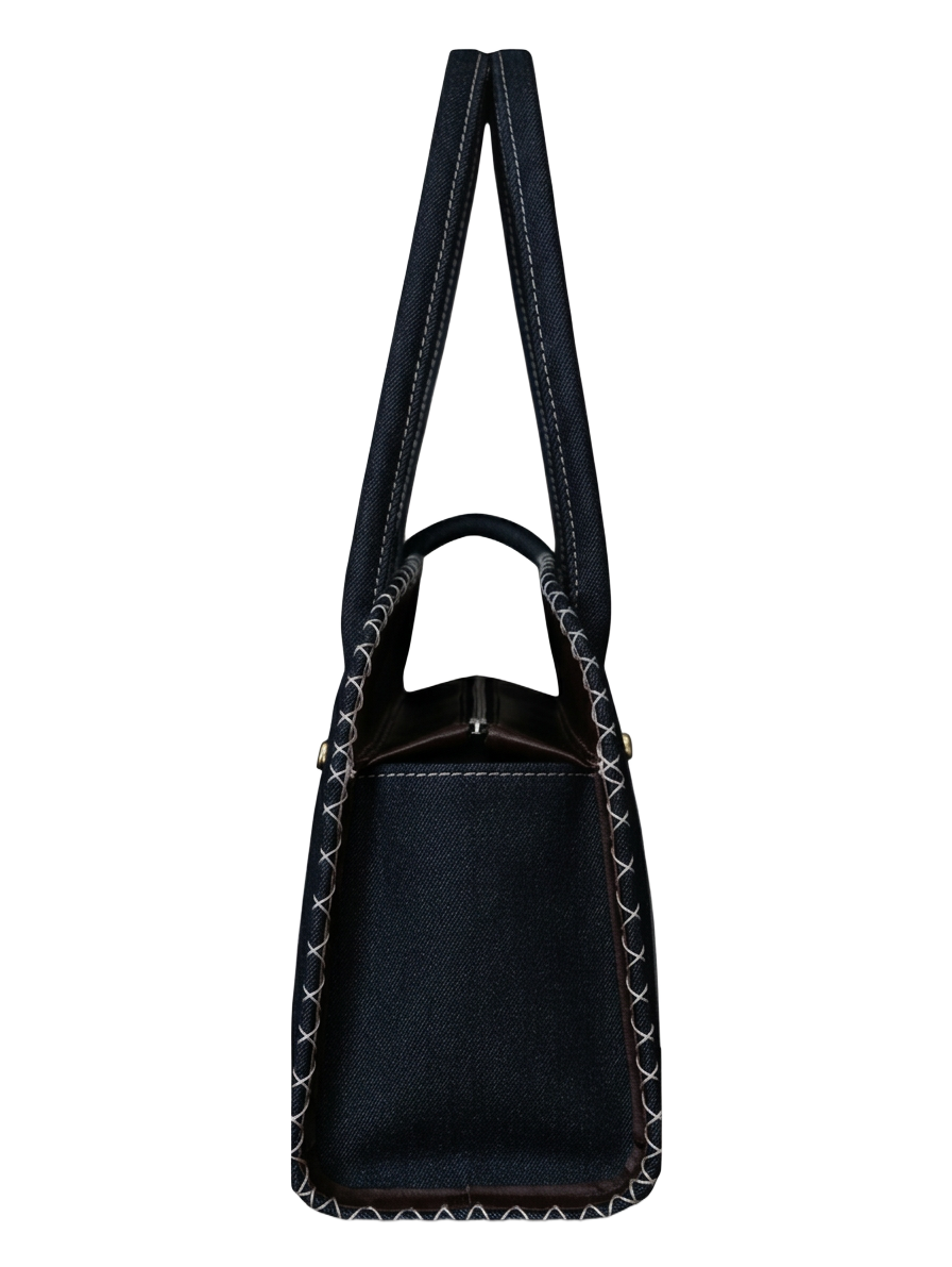 Side profile of the bag showing handles, gusset and hand-stitched edges