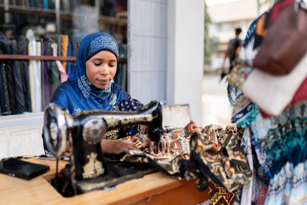 African Woman Sewing